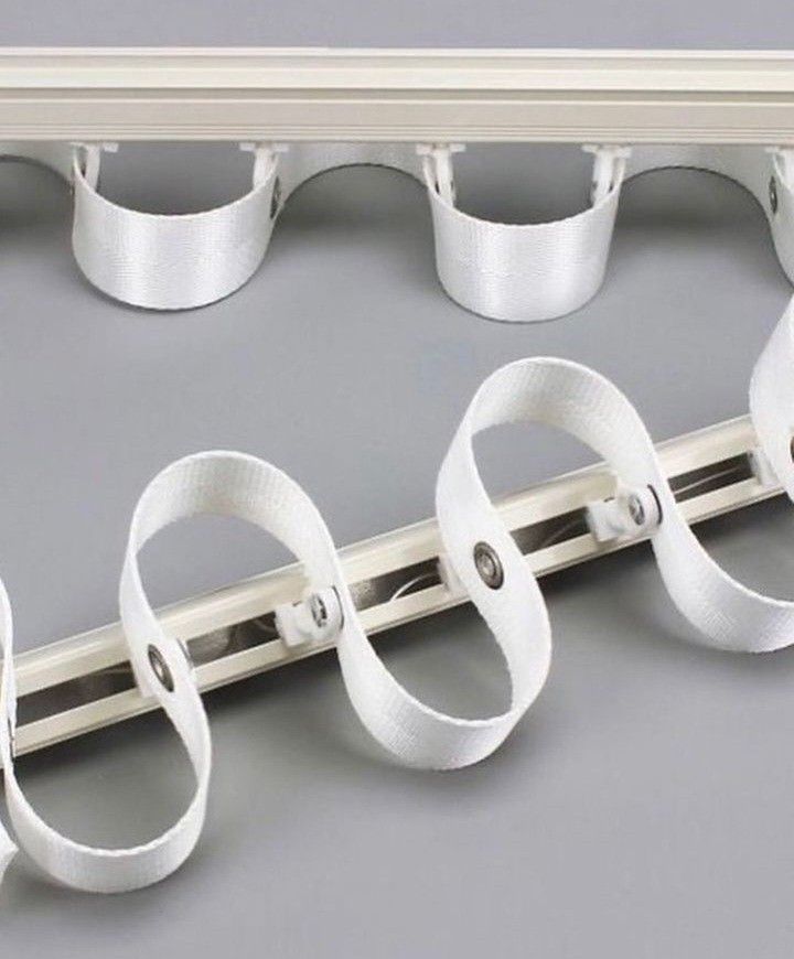 Ripple fold curtain tape on rail