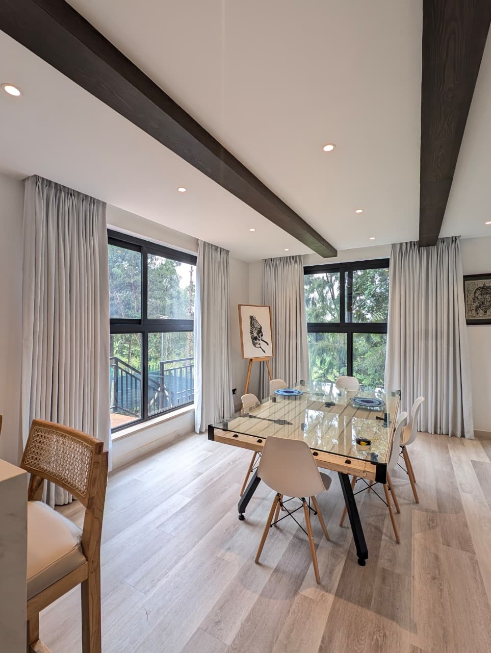 Dining room with custom white curtains