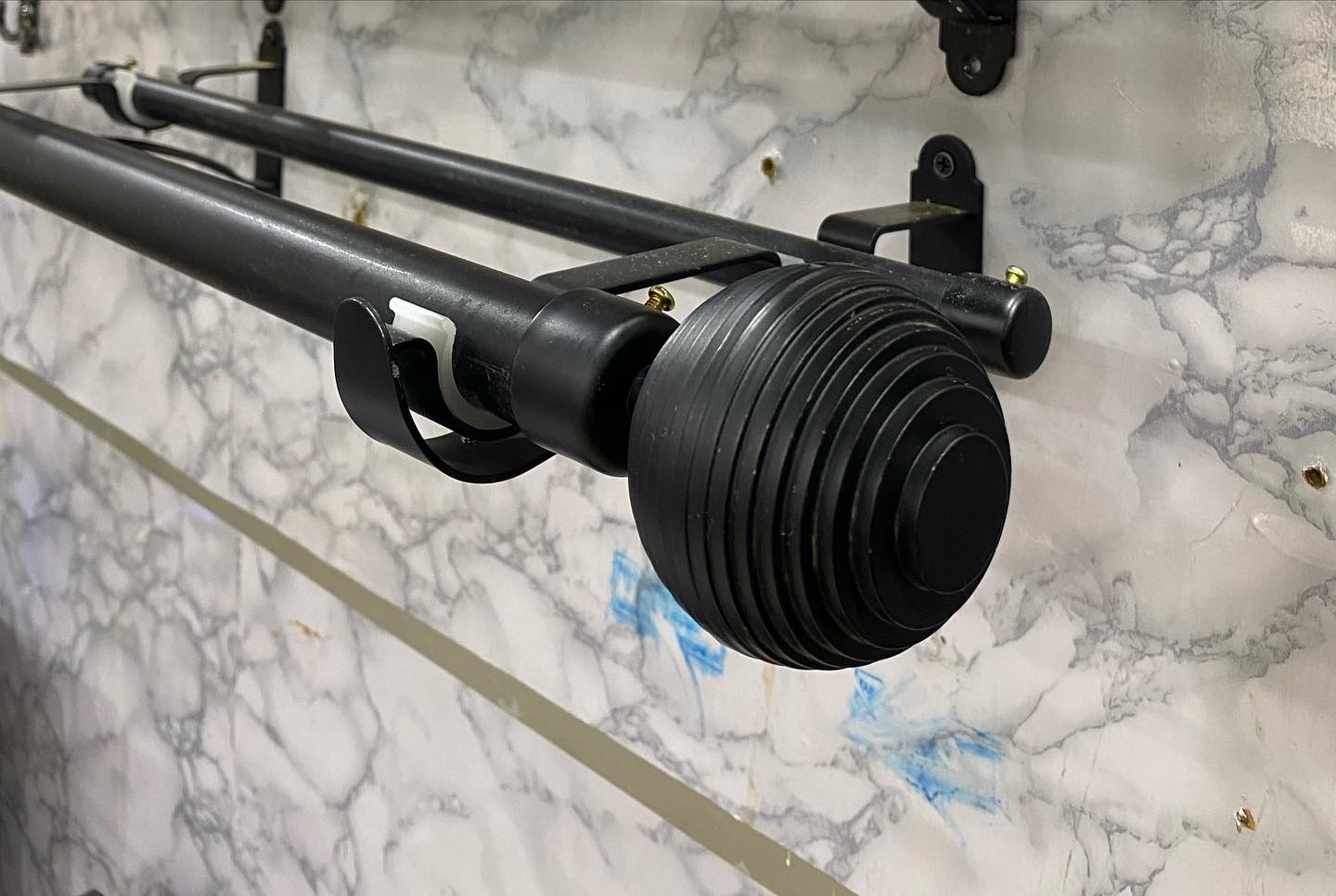 Side mount curtain rod with brass finials